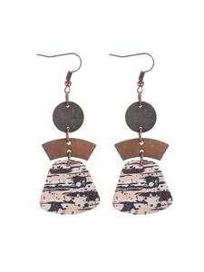 Detail showing the natural cork texture of bohemian multilayered geometric earrings.