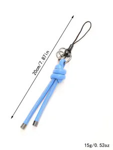 Close-up detail of a light blue braided leather keychain showing dimensions and weight