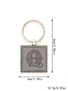 Macro detail of zinc alloy square keychain with embossed leather letter Q and size info