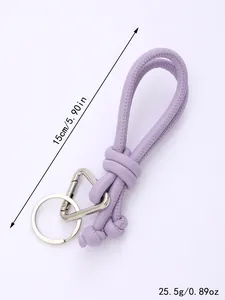 Detailed view of handmade purple woven PU leather keychain with length and weight specs