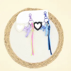 Heart-shaped leather makeup mirror keychain charms with handmade woven bow straps