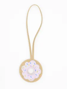 Close-up of a cute PU leather doughnut bag charm with pink icing and colorful sprinkles.