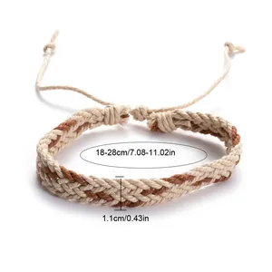 Close-up showing dimensions of the handmade woven rope bracelet in beige and brown