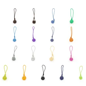 Detailed view of colorful handmade polyester monkey fist knot woven keychain charms
