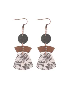 Detailed view of Bohemian multi-layer cork drop earrings with black leaf pattern.