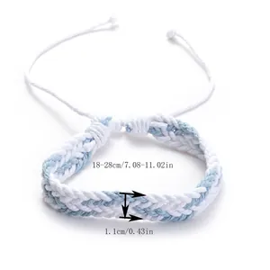 Close-up of blue and white braided wax rope bracelet showing 1.1cm width detail.