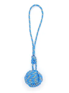 Detail view of a blue handmade polyester monkey fist knot braided keychain charm cord