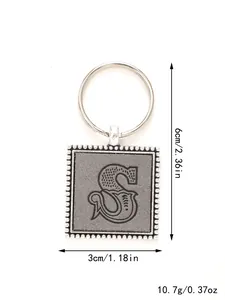 Detail view of letter S leather keychain showing dimensions 3x6cm and weight 10.7g.