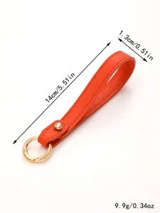Detailed 14cm dimensions and weight of this red textured leather wrist strap keychain