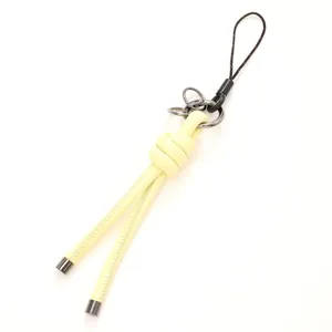 Handcrafted light yellow leather cord keychain with knot design for bag charm or phone