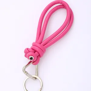 Handmade pink braided PU leather phone strap with silver keychain and metal lobster clasp