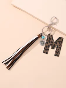 Leopard print leather letter M keychain with multi-color tassels and flower charm detail