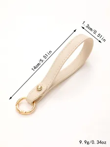 Detailed view of beige leather wristlet keychain strap with dimensions and weight