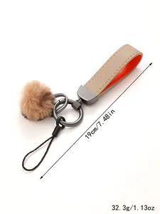 Kunstleder-Schlüsselanhänger mit Plüschbommel, Gesamtlänge 19 cm und Gewicht 32,3 g