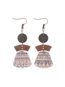 Detailed view of bohemian multi-layered geometric earrings with printed cork texture