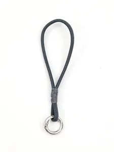Close-up of grey braided mobile phone wrist strap with silver metal ring connector