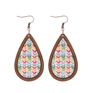 Bohemian teardrop wooden earrings with colorful chevron pattern on white background.