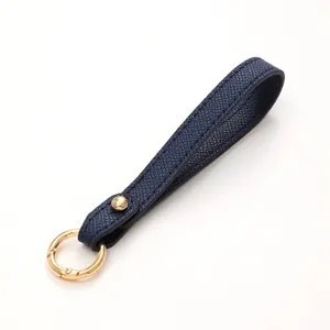 Elegant navy blue textured leather keychain strap with gold-tone circular metal ring
