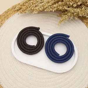 Close-up of 12-strand braided PU microfiber cords in brown and navy blue colors.