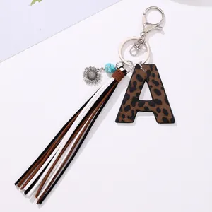 Close-up of leopard print leather letter A keychain with multi-color tassel