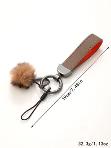 Detailansicht Leder-Schlüsselanhänger mit Bommel, Größe 19 cm und Gewicht 32,3 g