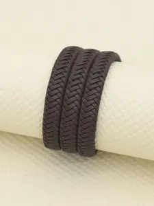 Macro detail shot of dark brown retro 12-strand braided PU leather strap texture
