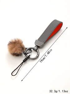 Detailansicht mit Maßen und Gewicht des Leder-Schlüsselanhängers mit Kunstfell-Pompon-Anhänger