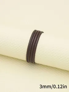 Close-up of 3mm dark brown faux sheepskin stitched cord with measurement detail