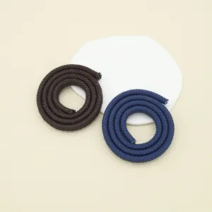 Detailed macro view of 12-strand braided PU leather cords in brown and navy blue