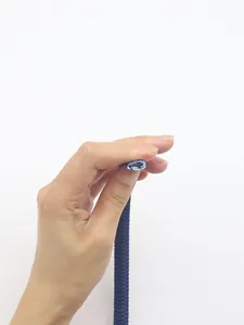 Close-up detail of blue 12-strand braided PU microfiber cord showing cross-section texture.