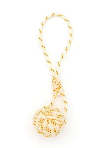 Detailed view of handmade polyester rope monkey's fist knot with yellow-orange patterns