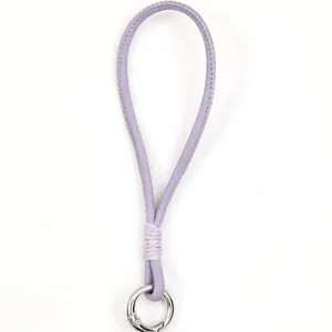 Handmade lavender purple leather phone wrist strap with a silver metal clasp ring