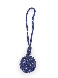 Close-up detail of the intricate hand-woven monkey's fist knot in blue polyester cord.