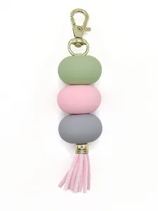 Macaron colored beaded keychain with soft pink tassel and gold-tone lobster clasp