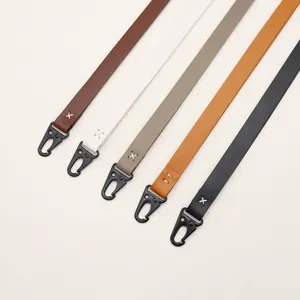 Detailed view of assorted PU leather lanyards with matte black metal swivel hooks