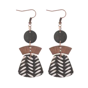 Bohemian multi-layer geometric earrings featuring natural wood and patterned cork