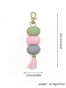 Detail view of macaron color acrylic keychain with tassel showing dimensions and weight