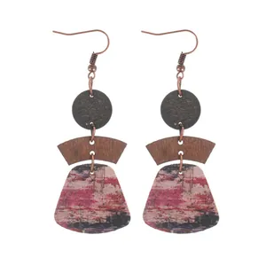 Bohemian multi-layer geometric cork drop earrings with colorful abstract pattern.
