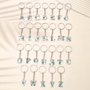 Full set of 26 Western-style alphabet keychains with turquoise inlay and silver finish.