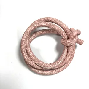 High-quality close-up of pink cross-stitched PU leather cord for DIY luggage and belt accessories