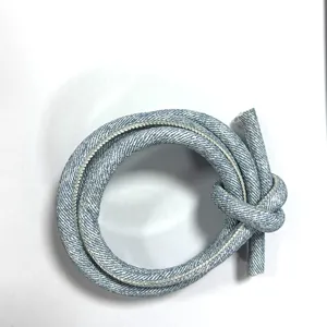 Close-up of PU leather cord with cross-stitch and denim texture for DIY accessories