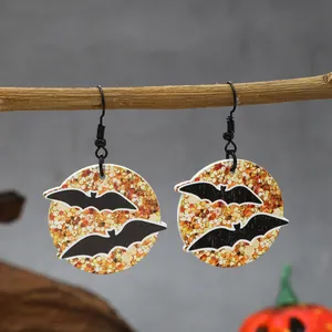 Macro view of Halloween wooden drop earrings featuring stylish black bat silhouettes