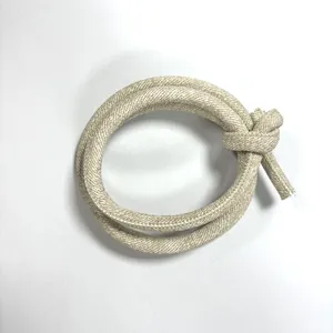 Detailed close-up of beige PU leather round cord with cross-grain stitching for DIY crafts