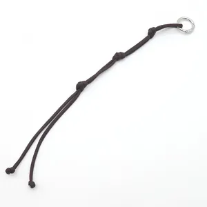Handmade dark brown woven polyester rope keychain with silver ring for bag charm.