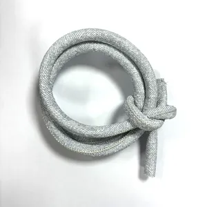 Macro detail of a grey round PU leather cord with white cross stitching for DIY projects