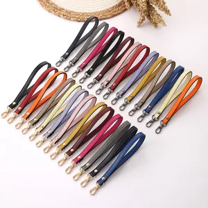 Assortment of colorful faux leather wristlet straps with metal lobster clasps for handbags
