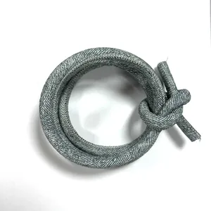 Close-up of grey cross-stitched round PU leather cord for DIY luggage and belt accessories