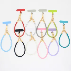Collection of colorful PU leather phone wrist straps with premium gold metal clips.