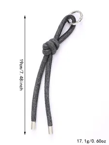 Dettaglio portachiavi in denim intrecciato con lunghezza 19 cm e peso 17,1 g indicati.