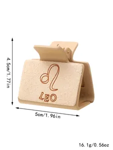 Crème haarklem met gegraveerd Leeuw-sterrenbeeld en afmetingen van 5 cm bij 4,5 cm